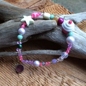 Handmade decora bracelet with cupcake and stars
